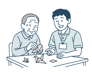 折り紙を折って楽しむ利用者さんと職員のイラスト